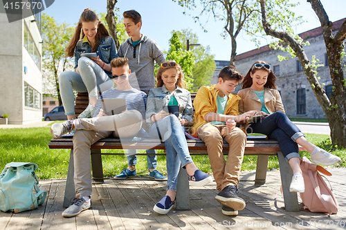 Image of group of students with tablet pc at school yard