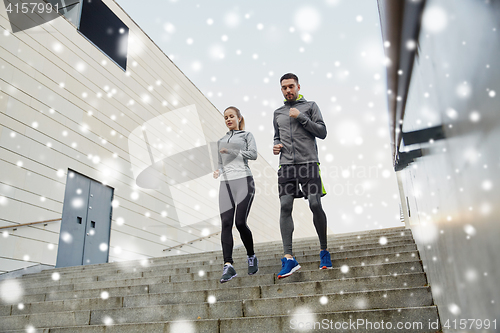 Image of couple of sportsmen walking downstairs