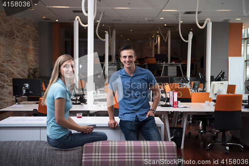 Image of startup business couple in a modern office