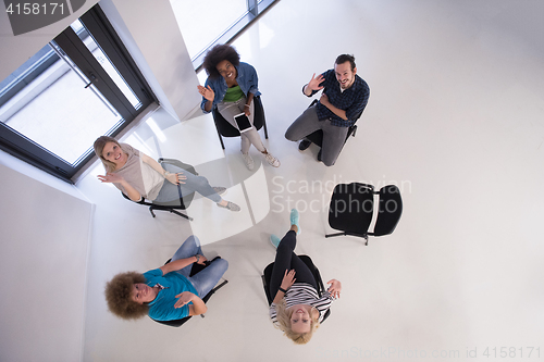 Image of Multiethnic startup business team on meeting  top view