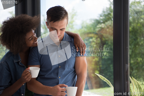 Image of romantic happy young couple relax at modern home indoors