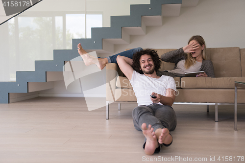 Image of young couple relaxes in the living room