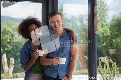 Image of romantic happy young couple relax at modern home indoors