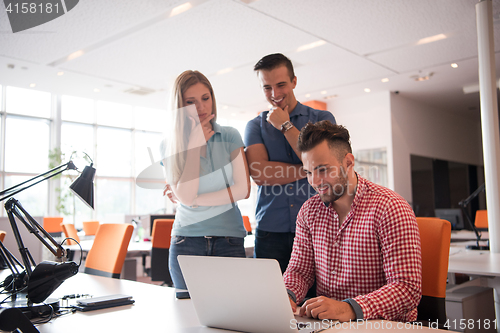 Image of Group of young people employee workers with computer