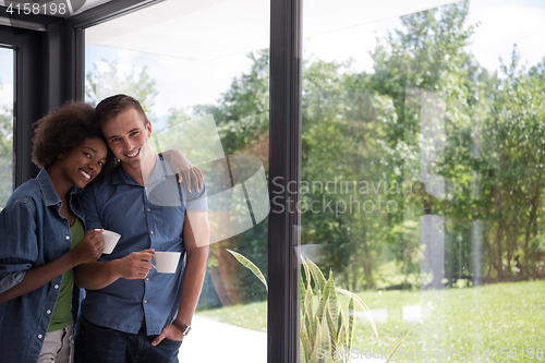 Image of romantic happy young couple relax at modern home indoors