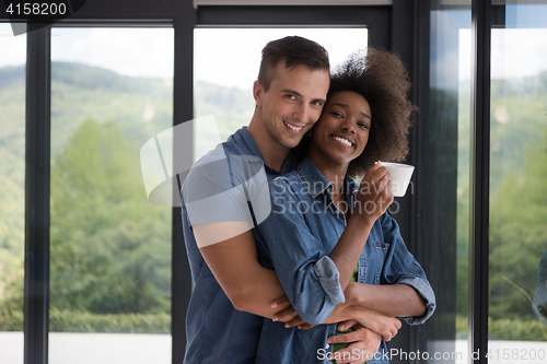 Image of romantic happy young couple relax at modern home indoors