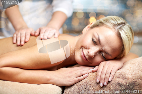 Image of close up of woman lying and having massage in spa