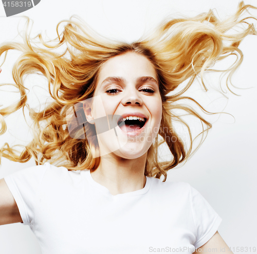 Image of young pretty blond teenage girl emotional posing, happy smiling isolated on white background, lifestyle people concept 