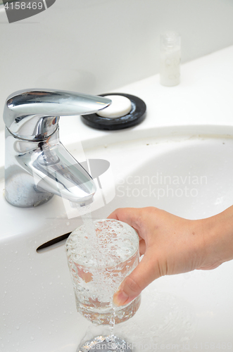 Image of Filling a glass with water
