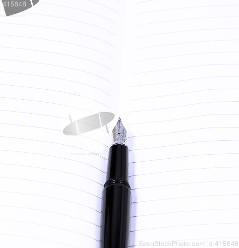 Image of fountain pen and notebook