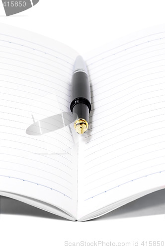 Image of fountain pen and notebook