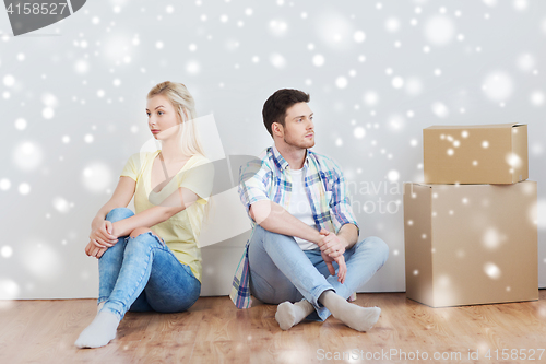 Image of unhappy couple having argument at home