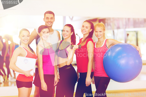 Image of group of smiling people in the gym