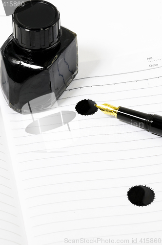 Image of fountain pen and notebook