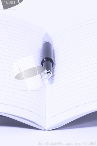 Image of fountain pen and notebook