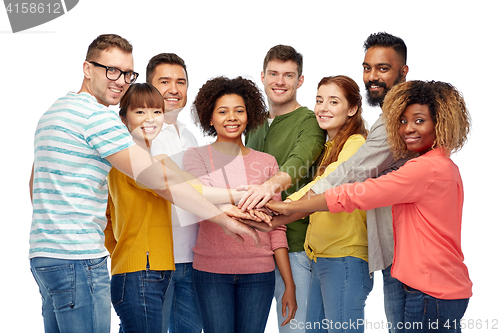 Image of international group of happy people holding hands