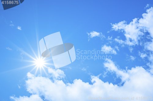 Image of blue sky background with the bright sun