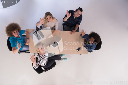 Image of Multiethnic startup business team on meeting  top view