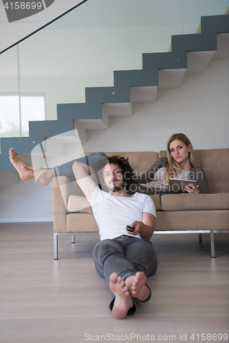 Image of young couple relaxes in the living room