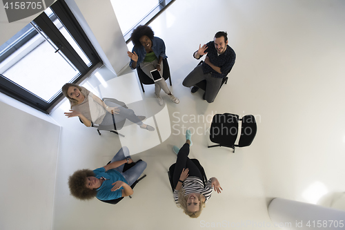 Image of Multiethnic startup business team on meeting  top view
