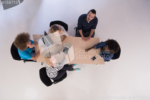 Image of Multiethnic startup business team on meeting  top view