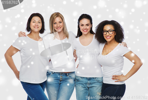 Image of group of happy different women in white t-shirts