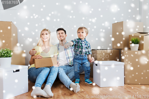 Image of happy family with boxes moving to new home