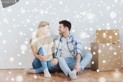 Image of couple with cardboard boxes moving to new home