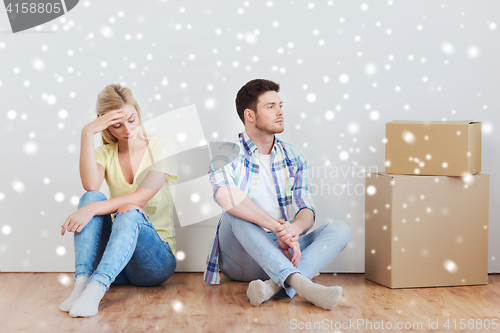 Image of unhappy couple having argument at home