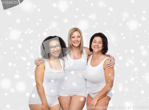 Image of group of happy plus size women in white underwear