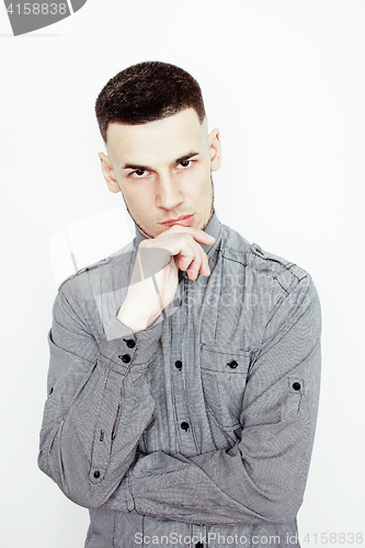 Image of young handsome well-groomed guy posing emotional on white background, lifestyle people concept 