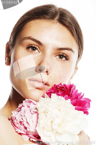 Image of young beauty woman with flower peony pink closeup makeup soft te