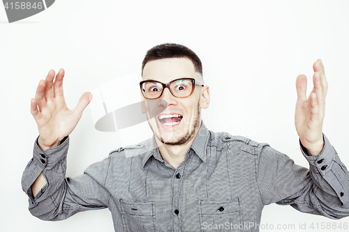 Image of young handsome well-groomed guy posing emotional on white background, lifestyle people concept 