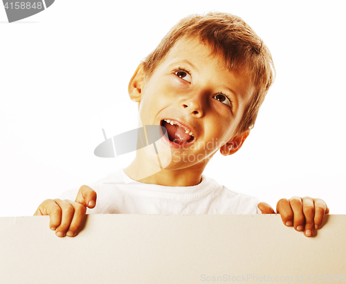 Image of little cute boy holding empty shit to copyspace isolated close u