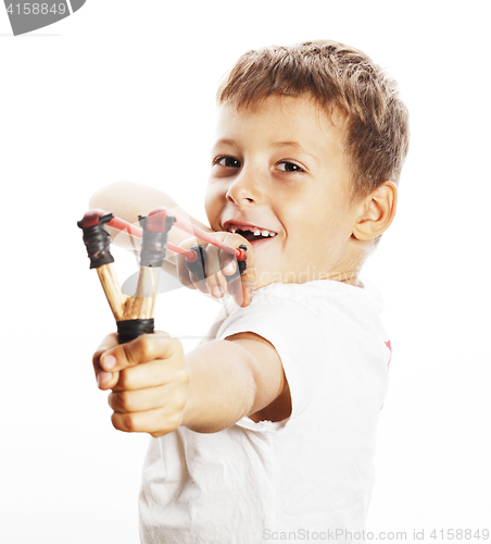 Image of little cute angry real boy with slingshot isolated