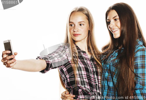 Image of cute teenage girls making selfie isolated