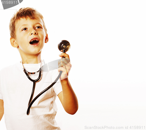 Image of little cute boy with stethoscope playing like adult profession d