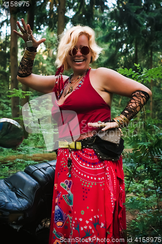 Image of Mature Woman Biker In Hippie Style