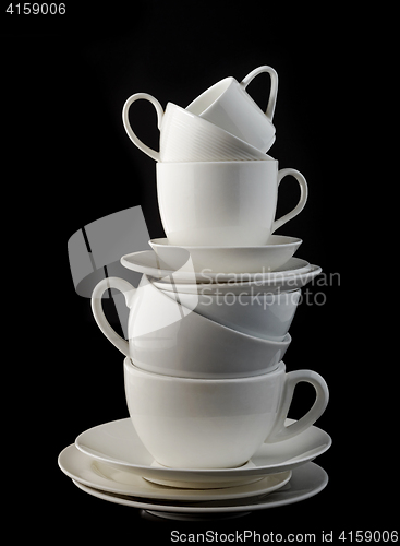 Image of stack of white coffee cups and plates