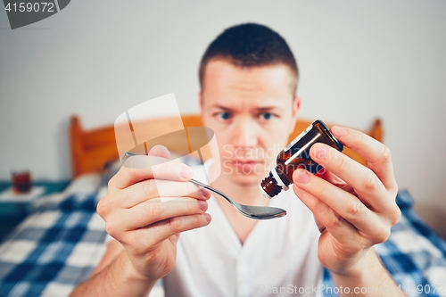 Image of Sick man in bedroom