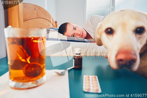 Image of Sick man in bed