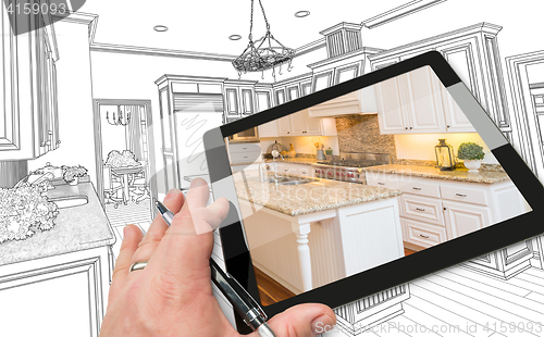 Image of Hand on Computer Tablet Showing Photo of Kitchen Drawing Behind.