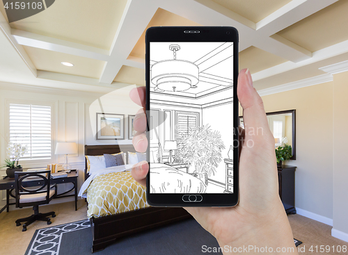 Image of Hand Holding Smart Phone Displaying Drawing of Bedroom Photo Beh