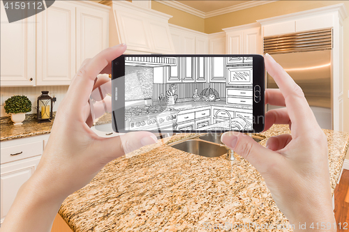 Image of Hands Holding Smart Phone Displaying Drawing of Kitchen Photo Be