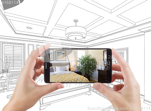 Image of Hands Holding Smart Phone Displaying Photo of Bedroom Drawing Be