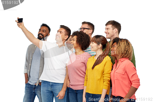 Image of group of people taking selfie by smartphone