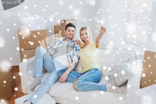 Image of couple with boxes moving to new home and dreaming