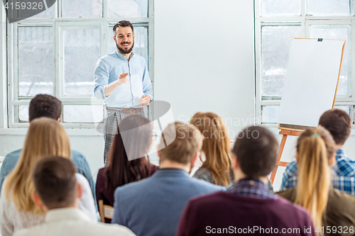 Image of Speaker at Business Meeting in the conference hall.