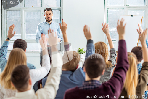 Image of Speaker at Business Meeting in the conference hall.