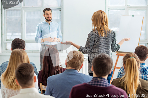 Image of Speaker at Business Meeting in the conference hall.